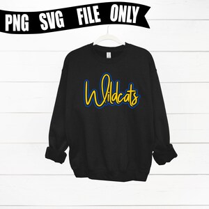 May include: Black sweatshirt with a yellow and blue "Wildcats" graphic.