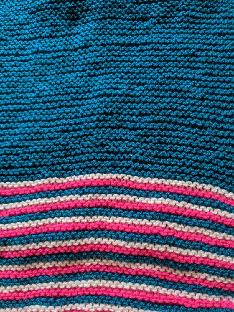 Hand knit scarf unisex vibrant colours to edge.