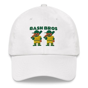 May include: White baseball cap with an embroidered design of two cartoon baseball players with the text "Bash Bros" above them.