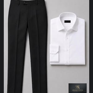 May include: A pair of black trousers with a button closure and a crisp white long-sleeve button-down shirt with a collar. A small rectangular black label in the corner displays the gold text Atelier Suits Co. with a stylized logo above it.