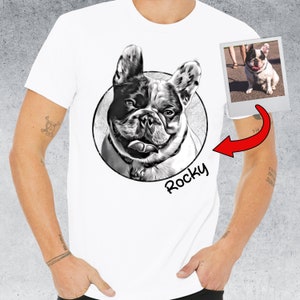 May include: White t-shirt with a black and white illustration of a French Bulldog in a circle with the name "Rocky" underneath. A smaller photo of the dog is in the top right corner.