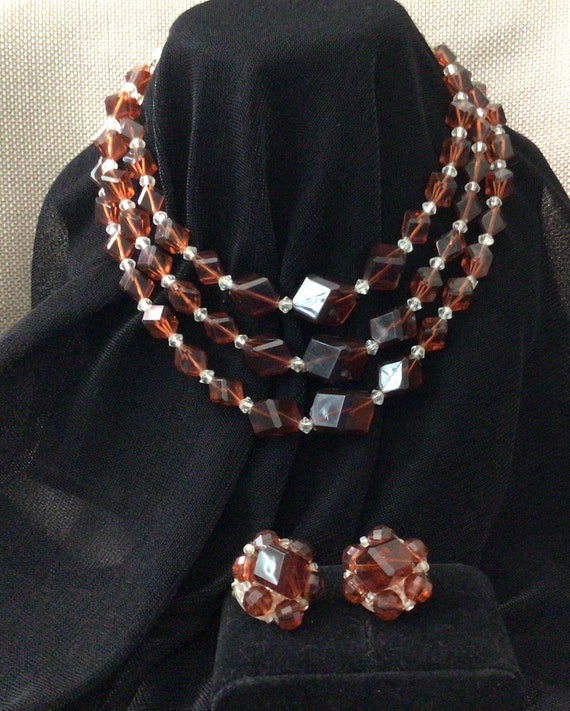 Amber bead necklace with cluster earrings.