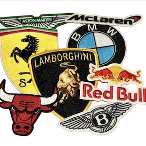 May include: A collection of embroidered patches featuring various car logos, including Ferrari, Lamborghini, McLaren, Aston Martin, BMW, Red Bull, and Bentley.