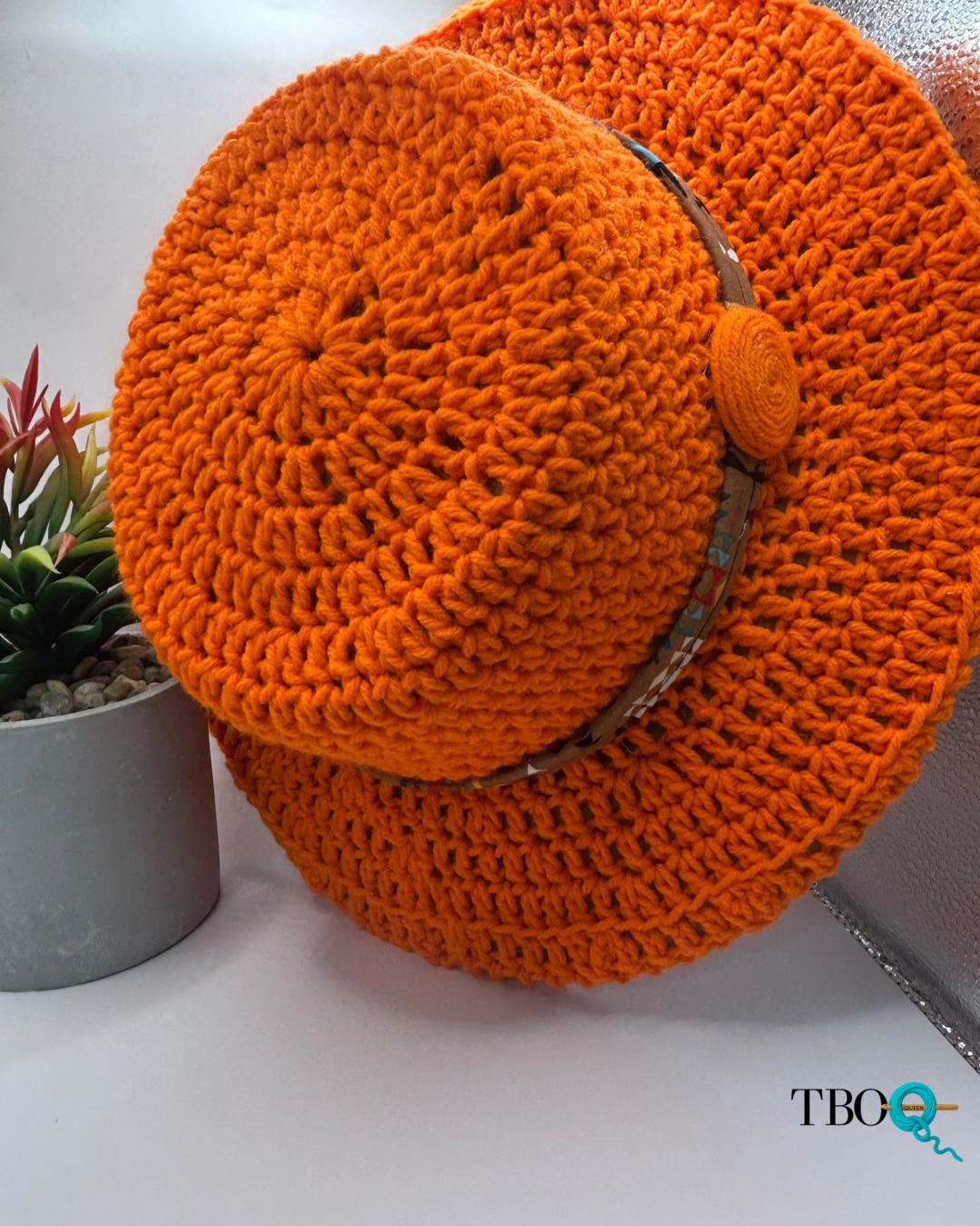 30 Hippie Crochet Patterns for Boho Outfits, Bags, Home Décor, and Gifts 9 Orange Crocheted Fedora with Patterned Band