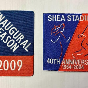 May include: Two embroidered patches. One blue and orange patch reads "INAUGURAL SEASON 2009". The other blue and orange patch reads "SHEA STADIUM 40TH ANNIVERSARY 1964-2004" with baseball player figures.