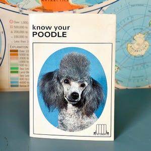May include: A vintage book cover with the text "know your POODLE" above a portrait of a gray poodle against a blue oval background. The book has a white border and the logo of "THE PET LIBRARY LTD" at the bottom.