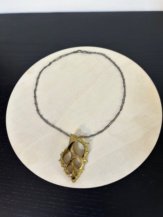 Golden Center Slice Seashell on 2 string oxidized… - image 2