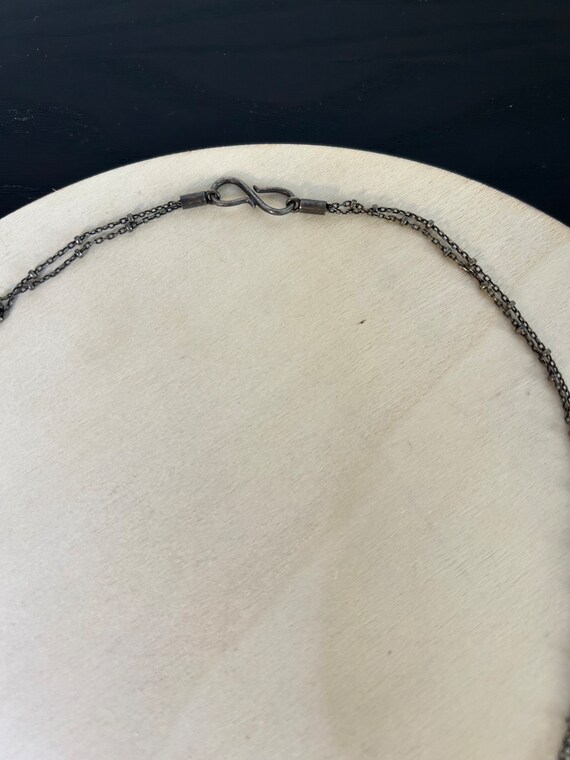 Golden Center Slice Seashell on 2 string oxidized… - image 1