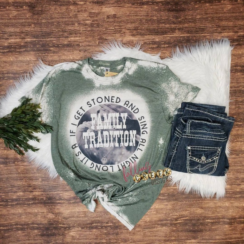 Family Tradition, country song shirt with vintage style photo in background.  Circle design shown on military green bleached unisex fit tshirt.
