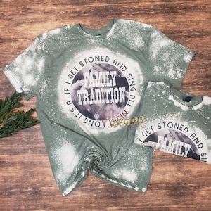 Family Tradition, country song shirt with vintage style photo in background.  Circle design shown on military green bleached unisex fit tshirt.