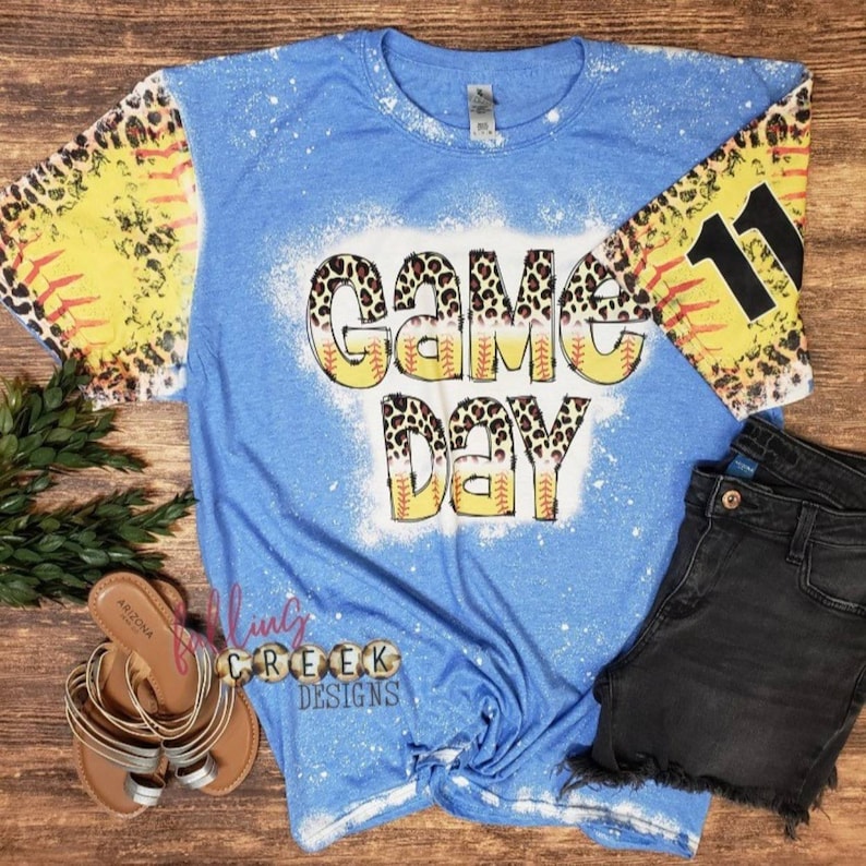 Game Day,  softball and leopard distressed letters. Softball and leopard distressed sleeves, front and back bleached tshirt.