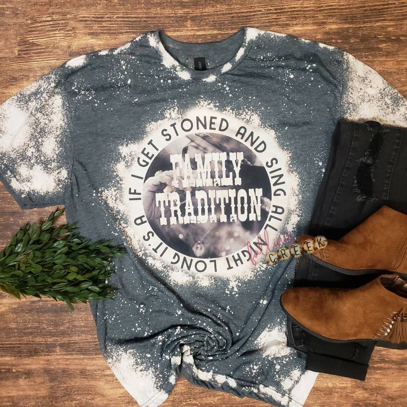 Family Tradition, country song shirt with vintage style photo in background.  Circle design shown on dark grey bleached unisex fit tshirt.
