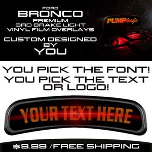 May include: A black and orange vinyl decal for a Ford Bronco 3rd brake light. The decal says "YOUR TEXT HERE" and is customizable with your own text or logo.