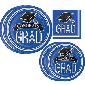 May include: A set of graduation party supplies, including blue and white paper plates and a napkin. The plates and napkin feature a graduation cap graphic and the words "CONGRATS GRAD" in white lettering.