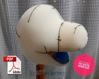 May include: A white foam puppet head with black lines drawn on it for sewing. The puppet head is on a wooden dowel rod. The text "My Puppet Factory" is visible below the puppet head. A red starburst with the text "Printable PDF Digital Download!" is in the lower right corner of the image. A PDF icon with the Adobe logo is in the lower left corner of the image.