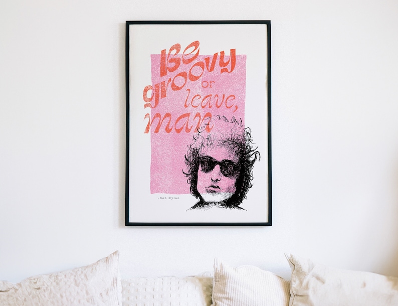 Bob Dylan be groovy or leave man quote framed artwork on a white wall in a modern living room