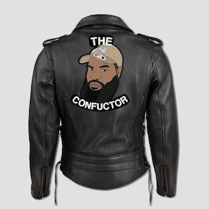May include: Black leather motorcycle jacket with a patch featuring a bearded man wearing a cap. The patch has the text "THE CONFUCTOR" in white lettering. The jacket has a classic biker style with zippers and laces.