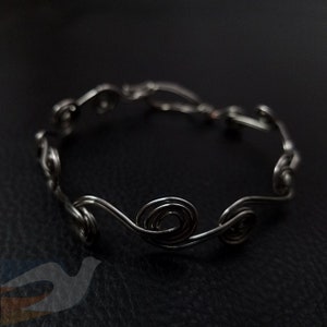 silver swirl wire-wrapped bracelet
