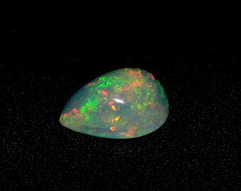 50/% discount on 0.60 ct Ethiopian welo opal.. Fire opal CABOCHON... 8x6 mm