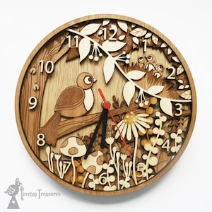 May include: A wooden clock with a bird and floral design. The clock face has Roman numerals and a red second hand. The clock is made of wood and has a natural finish.