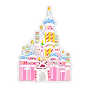 May include: A pink and white castle cake with blue and yellow candles and colorful sprinkles. The castle has a large number "25" on the front.