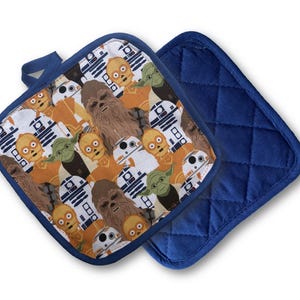 May include: Two square pot holders. One features a pattern of Star Wars characters including Chewbacca, Yoda, and R2-D2. The other is solid navy blue with a quilted design. Both have a navy blue loop for hanging.