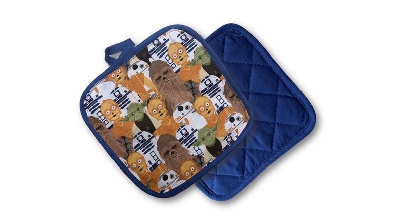 May include: Two square pot holders. One features a pattern of Star Wars characters including Chewbacca, Yoda, and R2-D2. The other is solid navy blue with a quilted design. Both have a navy blue loop for hanging.