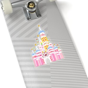 May include: A pink and white sticker of a birthday cake version of Cinderella's castle with the number 25 on the front. The castle is decorated with candles, sprinkles, and hearts.