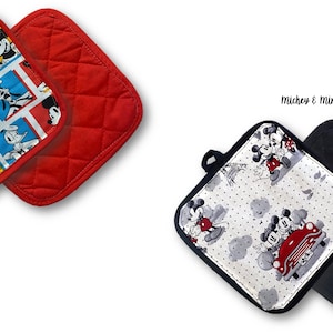May include: Two sets of red and black quilted pot holders. One set features a colorful pattern of Mickey Mouse and friends. The other set features a black and white pattern of Mickey and Minnie Mouse on a date.