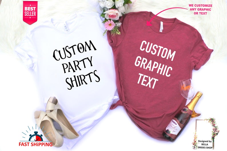 May include: Two t-shirts, one white and one maroon, with the text "Custom Party Shirts" and "Custom Graphic Text" printed on them. The shirts are laid out on a white surface with flowers and a bottle of sparkling wine.
