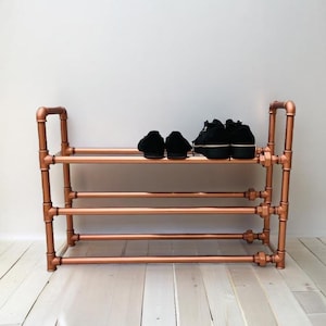 Sapateira - Bosse Red Hot - na cor cobre da moda, feita de tubos de aço resistentes