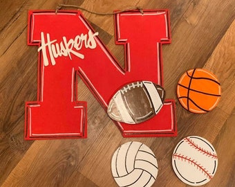 Interchangeable Husker Door Hanger. Various Styles.