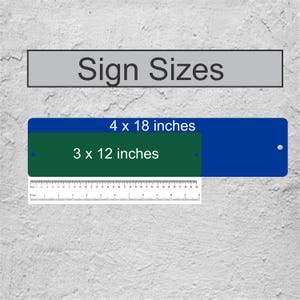 May include: Sign sizes for a custom sign. The sign is 4 x 18 inches and 3 x 12 inches. A ruler is shown for scale.