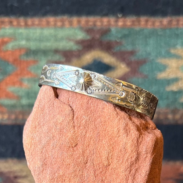 Fred Harvey Era Native American Sterling Cuff with Arrows, Whirling Log and Repoussé Dome Details