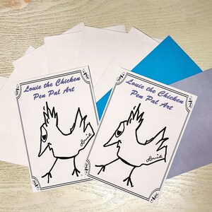May include: Two cards with a cartoon chicken illustration and the text "Louie the Chicken Pen Pal Art" are displayed with white envelopes, and blue and purple envelopes. The chicken is drawn in black ink.