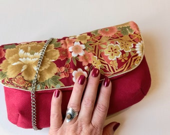 Red Versaillaise clutch, suede and Japanese fabric with gold flowers, chain shoulder strap and carabiners
