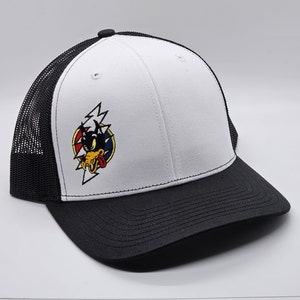 May include: White and black trucker hat with a black and white cartoon wolf with a red tongue and lightning bolt design. The wolf is wearing a red, white and blue bandana.
