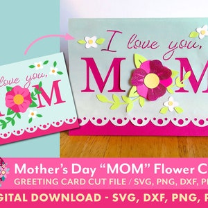 Peut inclure: T&eacute;l&eacute;chargement num&eacute;rique d'un fichier de d&eacute;coupe de carte pour la f&ecirc;te des m&egrave;res. La carte pr&eacute;sente un motif de fleurs roses et blanches avec les mots "Je t'aime, MAMAN" en lettres roses.