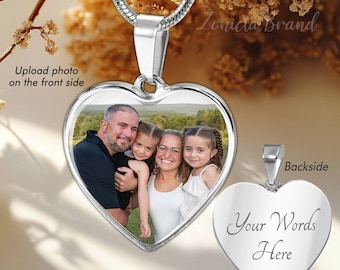 May include: Silver heart-shaped pendant necklace with a photo of a family of four on the front and the words "Your Words Here" engraved on the back.