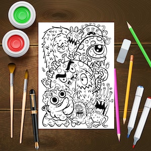 May include: A black and white colouring page featuring a variety of cartoon monsters with googly eyes and other whimsical features. The page is surrounded by art supplies, including paintbrushes, markers, pencils, and a rubber.