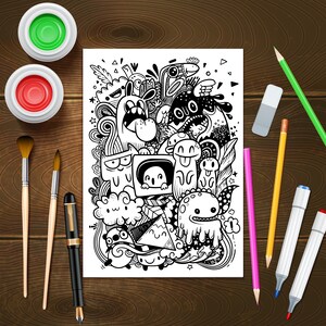 May include: A black and white doodle illustration of a variety of cartoon characters and abstract shapes on a white sheet of paper. The paper is surrounded by art supplies including paintbrushes, pencils, markers, and paint pots.
