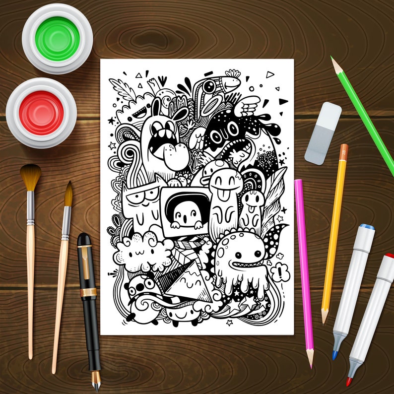 May include: A black and white doodle illustration of a variety of cartoon characters and abstract shapes on a white sheet of paper. The paper is surrounded by art supplies including paintbrushes, pencils, markers, and paint pots.