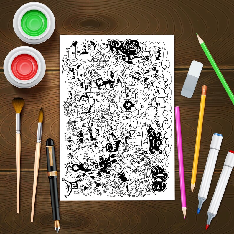 May include: A black and white doodle art print featuring a variety of whimsical characters and designs. The print is surrounded by art supplies, including paintbrushes, coloured pencils, markers, and a rubber.