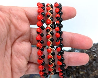 Pulsera trenzada de DOBLE Semilla de Chirmi | Chirmí negro | Amuleto de la suerte y protector de la envidia y las malas energías.