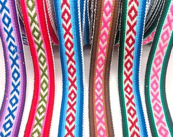 May include: Close-up of colorful woven ribbons with geometric patterns. The ribbons feature a variety of colors, including red, blue, green, pink, and brown, with white accents. The ribbons are likely used for crafting or decorative purposes.