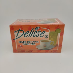 May include: A box of Delisse Mate de Coca Coca Tea, a natural product from Peru. The box features an illustration of a cup of tea and a glass of iced tea with a lemon wedge. The text on the box reads "Delisse Mate de Coca Coca Tea, Producto Peruano, Producto Natural, 25 filtrantes tea bags."