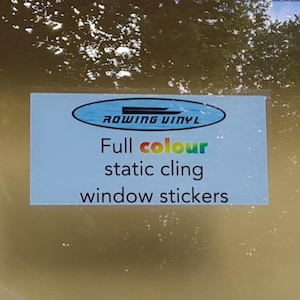May include: A blue and white sticker with the text "Rowing Vinyl" in a white oval. The text "Full colour static cling window stickers" is below the oval.