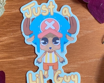 May include: A blue and pink cartoon sticker with a character wearing a blue hat with a pink brim and a yellow and white striped shirt. The text "Just a Lil' Guy" is written in yellow on a blue background.