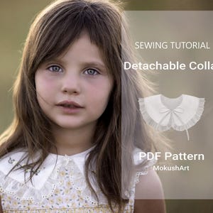 May include: A white detachable collar with a ruffle trim and a bow. The collar is shown on a young girl wearing a yellow floral dress. The text "Sewing Tutorial Detachable Collar PDF Pattern MokushArt" is displayed on the image.