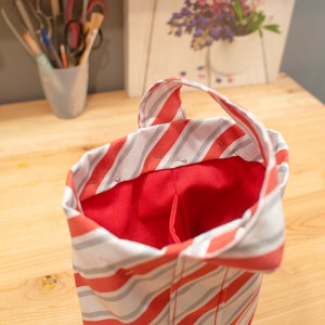 Sewing process of the top edge of the bag for a bottle of wine